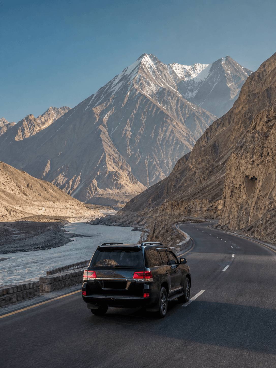 Four-wheel-drive vehicle travelling the Karakoram Highway toward Hunza