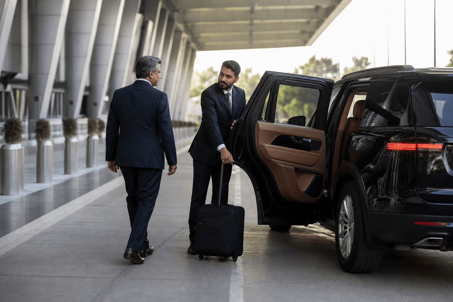 Chauffeur receiving a senior business traveller beside an executive SUV at Islamabad airport