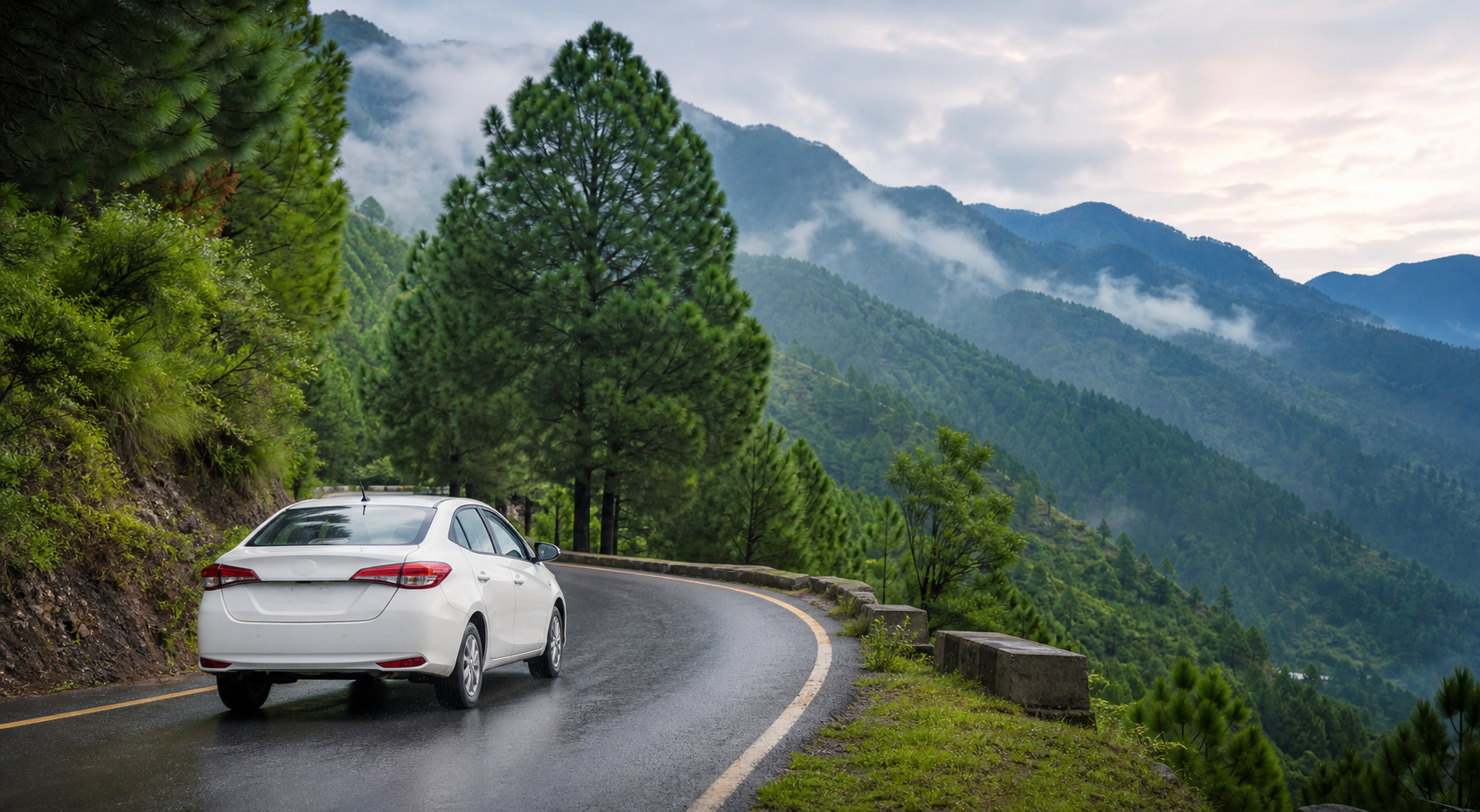 White private taxi driving on a wet mountain road through pine forests on the way from Islamabad to Nathia Gali